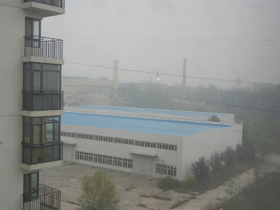 The smokestacks and construction site next door to my apartment in Beijing...and the lack of visibility of the next block over