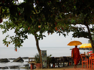 Monk walking down the beach at Sihanoukville 