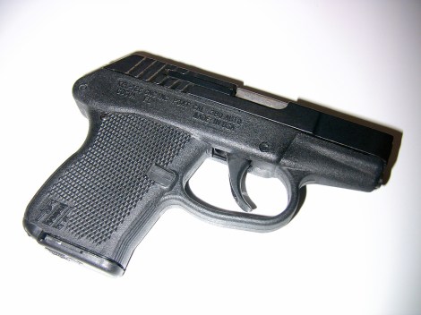 The gun he had was small and black, kinda like this. https://www.flickr.com/photos/robertnelson/439618118/in/photolist-aboDc7-mRUkhn-abkMYp-dzsvh2-feQop5-dV7sbX-5qNyMB-ER9t4-dxj5jj-eiDqJT-ERa9J-eiDqEx-9jq5Gz-vSYVz-5qNyFB-br7eYL-5qNyJT-4t1iUa-4NJNaZ-hg4T4z-dVd3go-ERabm-ER9zk-hg5cpy-bcVcdP-dxj4VW-4oiDmA-5qNByp-ERad3-4tYb4v-2sh9Au-bi6BB-cXgdw-nZdbf2-ERacd-4oezUH-ahkuxM-hg6jUZ-hg6jvx-dVd3eA-a3YYmH-a3YYvt-a3YYwx-a42QKh-89PSJT-a3YYxB-dxdCbk-5aGbSU-8bkrGh-hg5d5b