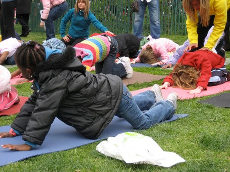 Kids love yoga- especially outside! Photo cred: https://www.flickr.com/photos/creativedc/3438229871/ 