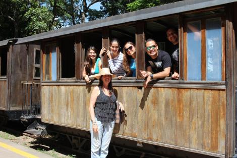 Some friends and I playing on the train like big kids